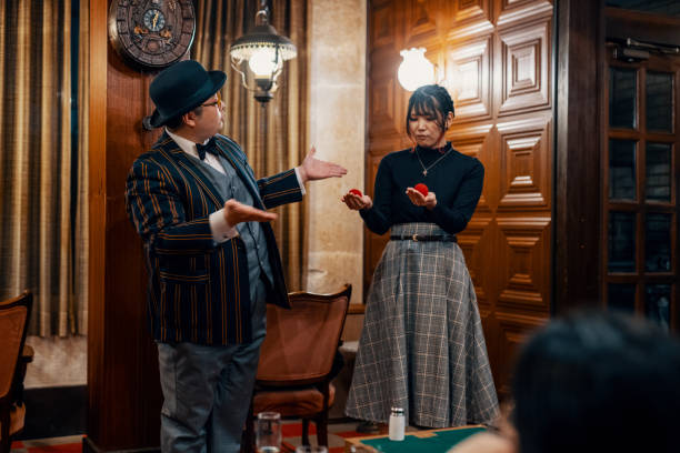istock Magician performing a small magic show at a restaurant 1474152135