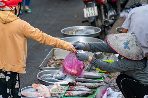 Ho Chi Minh City, Viet Nam 15 October, 2022: Colorful morning in Thi Nghe market. A traditional local market selling fresh food and vegetables in Vietnam