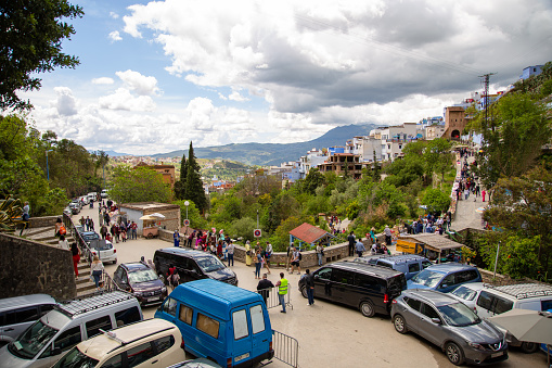 Chefchaouen, Morocco - 20 april 2019 : high angle view of tourists walking in Ras el-Ma