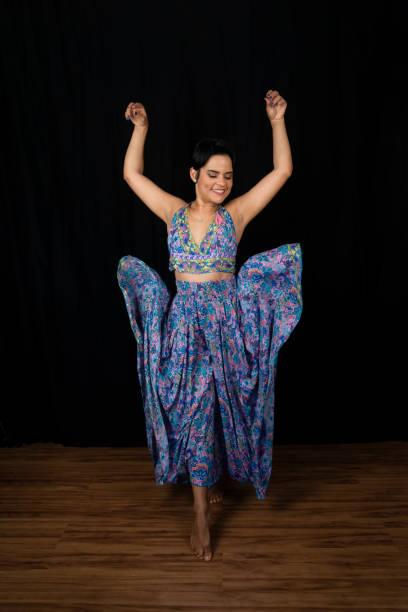 istock Portrait young woman dancing in studio. 1474153760