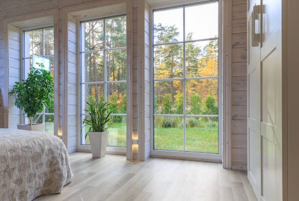 istock Bright photo studio interior with big window, high ceiling, white wooden floor 1474154016