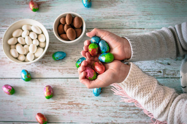 istock Girl holding chocolate Easter eggs 1474155552