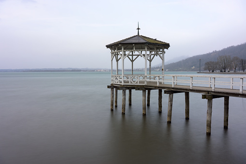 Fishermans footbridge on lake Constance (Bodensee) in Bregenz (Austria) on a stormy day in early spring