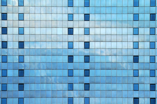 istock modern skyscraper glass facade for blue urban background 1474156130