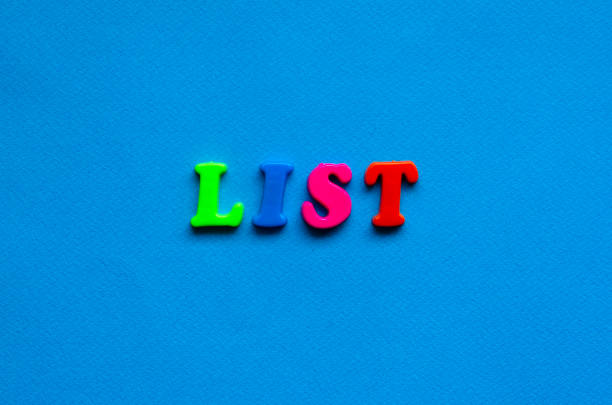 text list from plastic colored letters on blue paper background