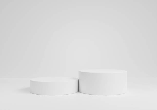 istock empty white podium.3D display podium on white background.Stand Minimal mockup for presentation.Abstract white background concept.Geometric platform show cosmetic product.Stage showcase.3D rendering 1474157092