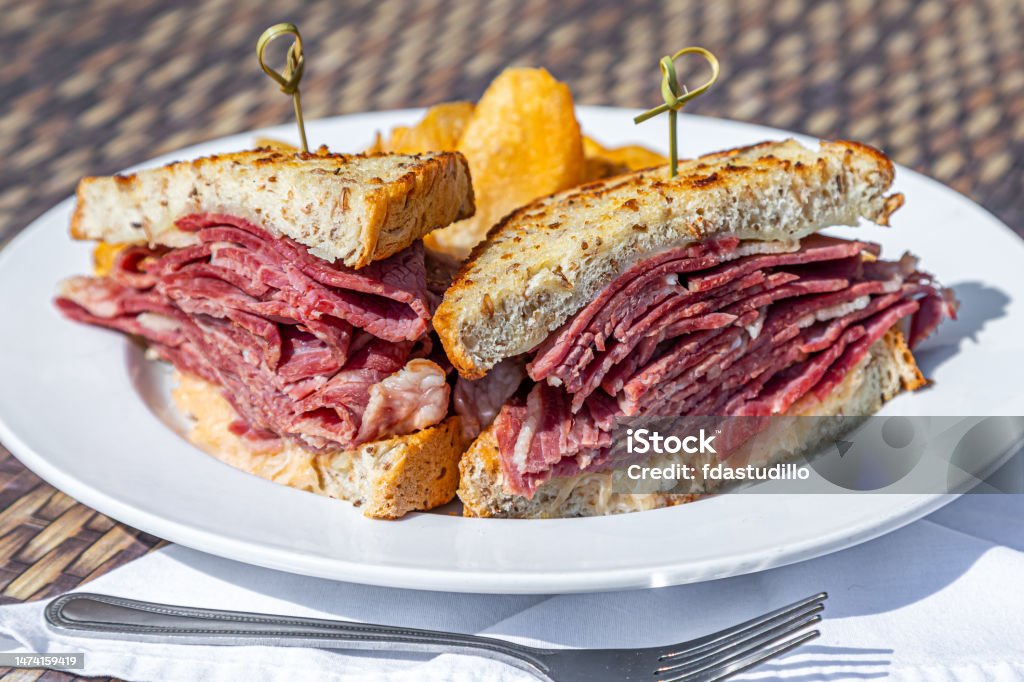 Food Photos - Various Entrees, Appetizers, Deserts, Etc. A variety of food items are displayed in an appetizing way. Reuben Sandwich Stock Photo