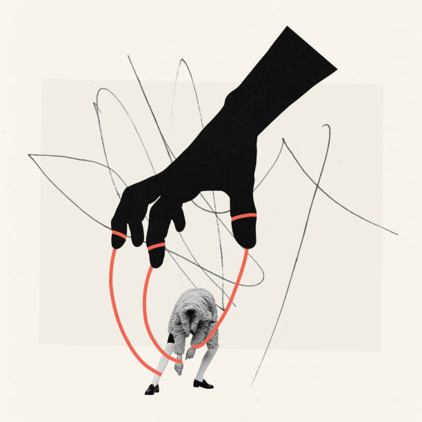 istock Contemporary art collage. Creative design. Giant black hand holding young boy on strings. Manipulation 1474161400