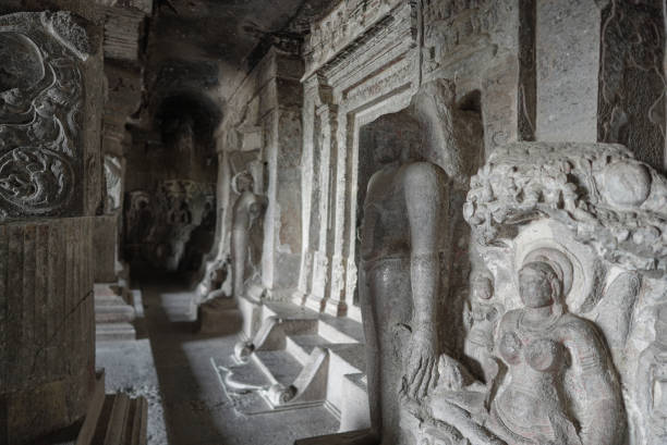 Ellora Caves Interiors Stone Sculptures guards outside Jain caves stock photo