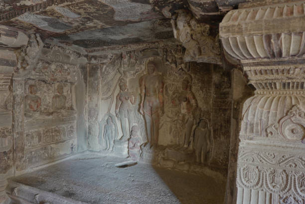 Ellora Caves Interiors Stone Sculptures of Jain realised souls like Mahavir and other tirthankars. stock photo
