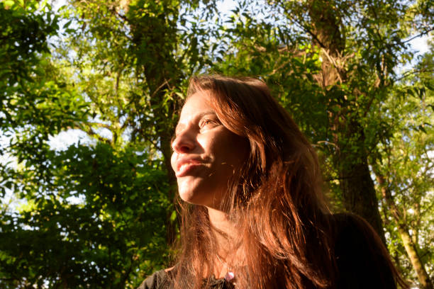 istock Young Woman Exploring a Park 1474163298