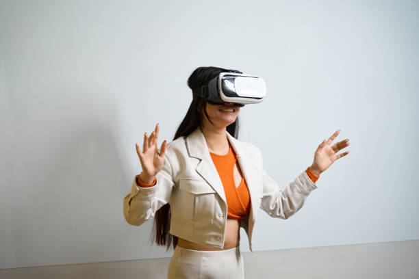 istock Pleased female company employee undergoing VR training 1474164159