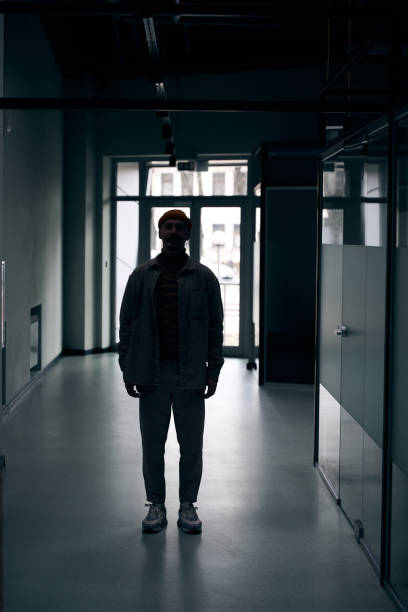 istock Pleased corporate worker posing for camera inside office building 1474164559