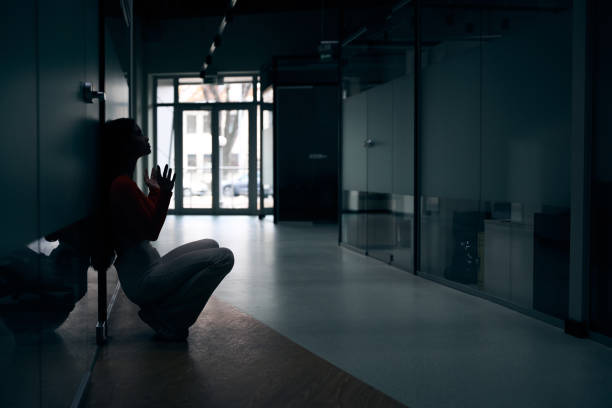 istock Dejected female office worker begging for help from above 1474164585