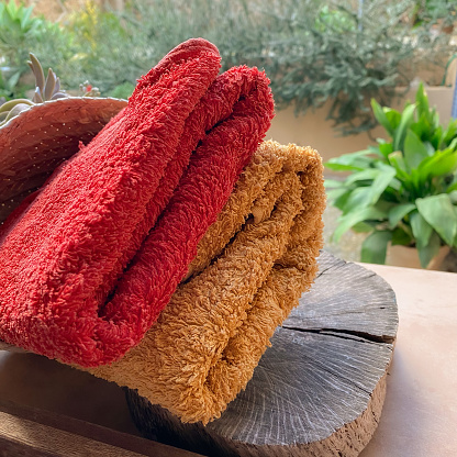 Still life with folded red and orange towels ready to use