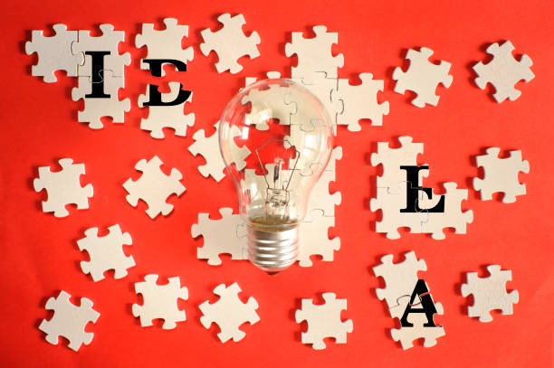 istock Business concept,idea,solution,innovation, team building,teamwork.Light bulb and jigsaw puzzle with caption. Free copy space. 1474166081
