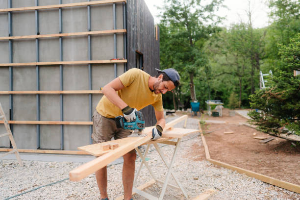 istock Carpenter cutting a wooden plank with a power tool 1474167443