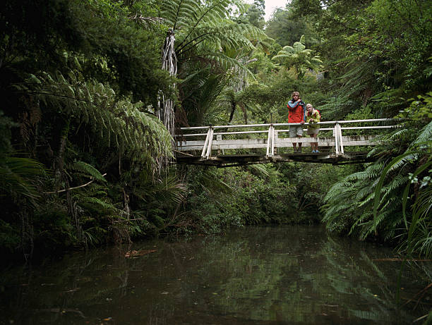 Young couple standing on bridge