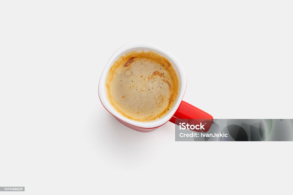 Red coffee cup with crema Red cup with coffee and crema isolated on 94% white background. Shot from above. High resolution, preserved highlights. Above Stock Photo
