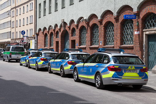 Munich, Germany - May 30 2019: Row of Police cars parked outside of a police station in the city center.