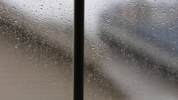 istock Rain water drops on the glass of a window 1474172617