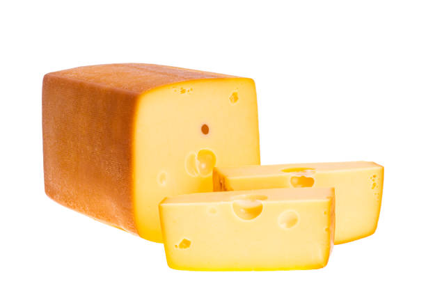 A piece of fresh processed cheese isolated on a white background.