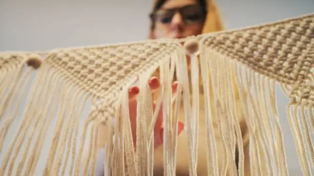 Handicraft. The art of braiding strings.