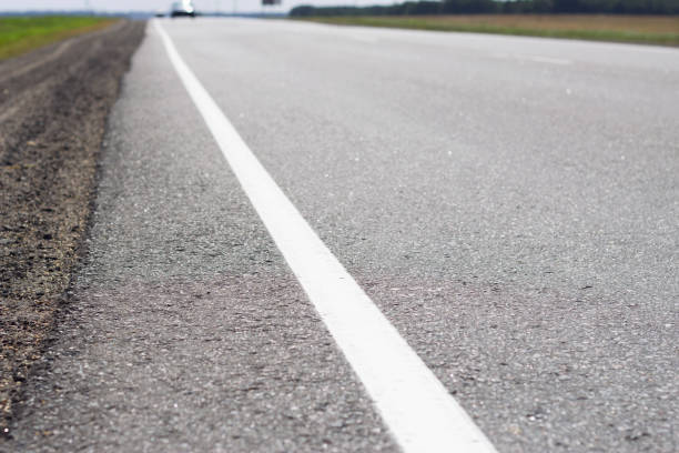 istock asphalt road in the countryside 1474175310