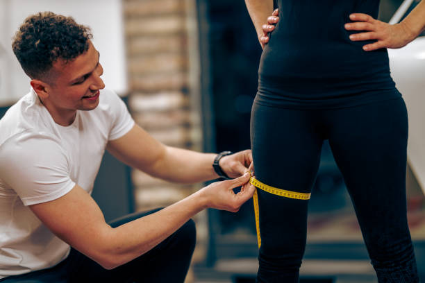 istock Coach Measuring Woman's Leg Volume 1474175990