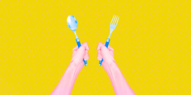 istock Contemporary digital collage art. Modern trippy design. Hands holding fork and spoon 1474178998