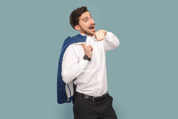 istock Amazed man with mustache standing pointing to camera, choosing you, flirting with attractive girl. 1474181533