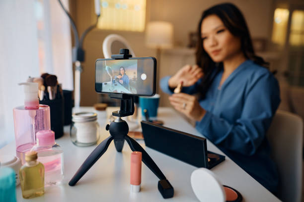 istock Close up of beauty vlogger recording makeup tutorial for her social media channel. 1474183437