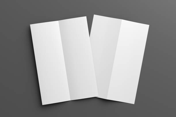 istock Half-folded flyer A4 vertical booklet mock up on gray background. View directly above 1474183499