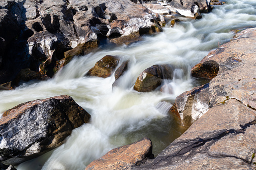 lozoya river in madrid flowing between the granite rocks