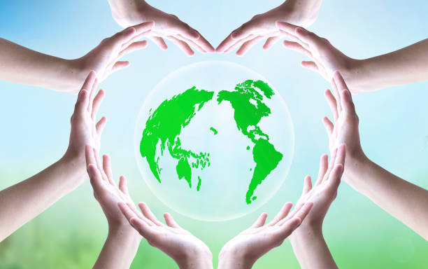 istock earth day concept, Earth globe in hands for heart shape over blue sky background. Elements of this image furnished by NASA 1474185267