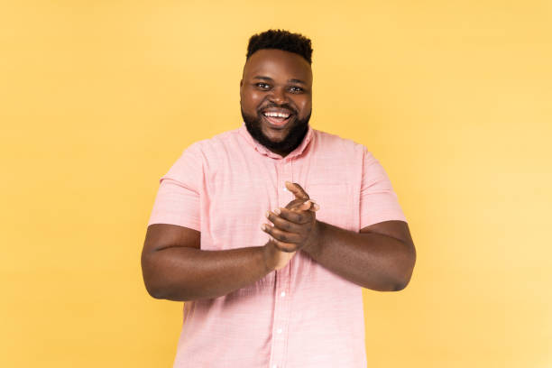 istock Man standing with palms together, applauding, clapping hands congratulating you with victory. 1474185282