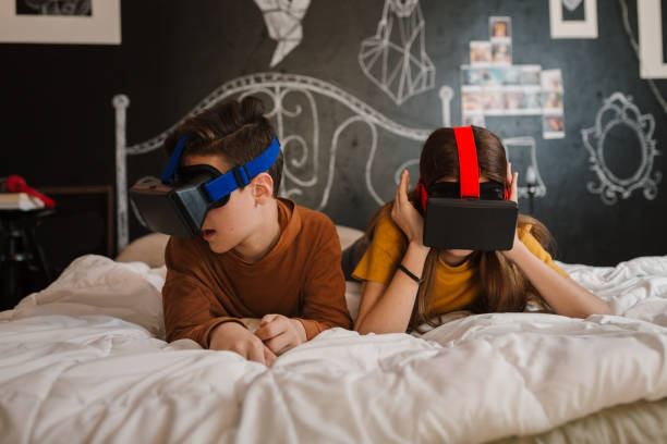 istock Teenagers watching trough VR glasses 1474189959