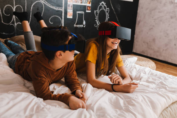 istock Teenagers watching trough VR glasses 1474189970