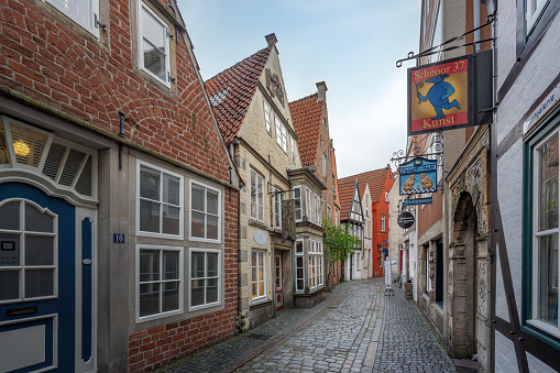 The building on the right is the outer wall of the Bruges landmark, Belfort. The place you walk toward this road is Marktplatz.