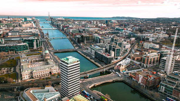 dublin ireland aerial view of river liffey and city center, aerial view of dublin skyline and samuel beckett bridge, aerial view of dublin city, ireland - dublin ireland place of worship church travel destinations imagens e fotografias de stock