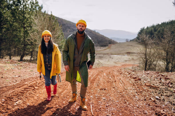 istock Two young engineers walk along a forest road 1474195347