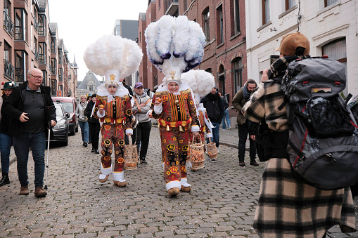 Gilles de Binche parading and dancing in a street, Binche, Belgium