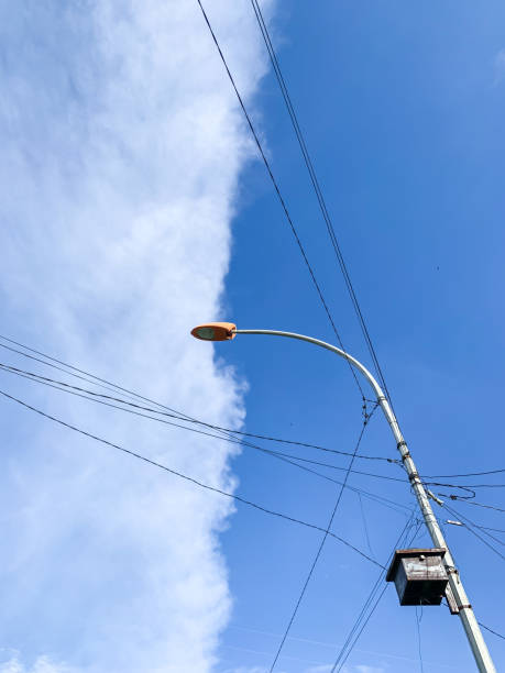 istock Electricity, cable lines, cloud, blue sky and street lights. 1474198106