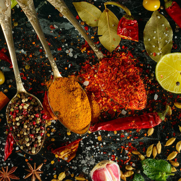 istock Many spices and aromatic herbs on a dark table. View from above. 1474199386