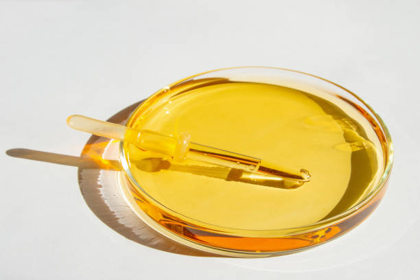 istock Petri dishes. With yellow liquid. With solution. Medical pipette. On a white background. 1474199444