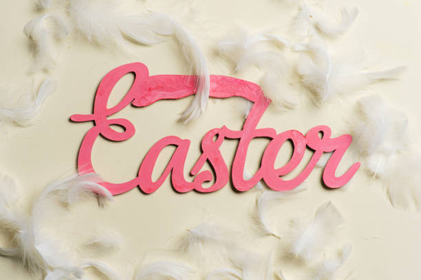 istock Easter celebration card with pink letters on yellow background. Easter note 1474199643