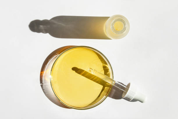 istock Petri dish. With yellow liquid. With solution. Cosmetic pipette. Comedy bottle. On a white background. 1474199882