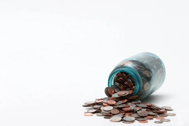 Coins in a blue canning jar