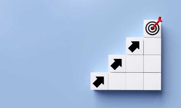 istock White cube with arrow pointing to target icon with copy space. 1474201308
