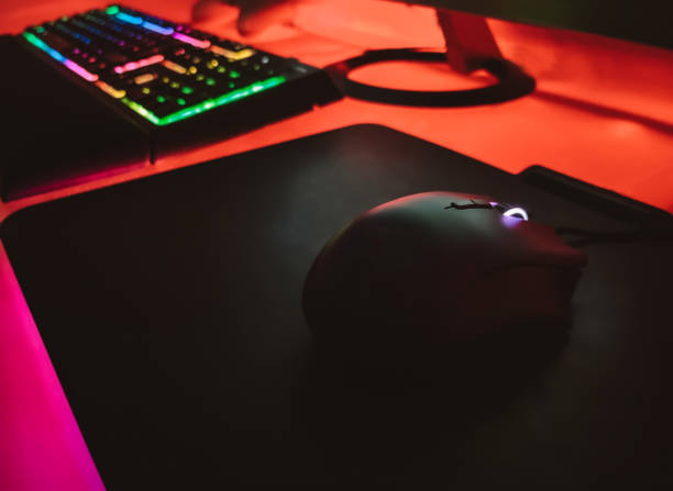 istock Mouse gamer on a work desk with lots of lights 1474201945